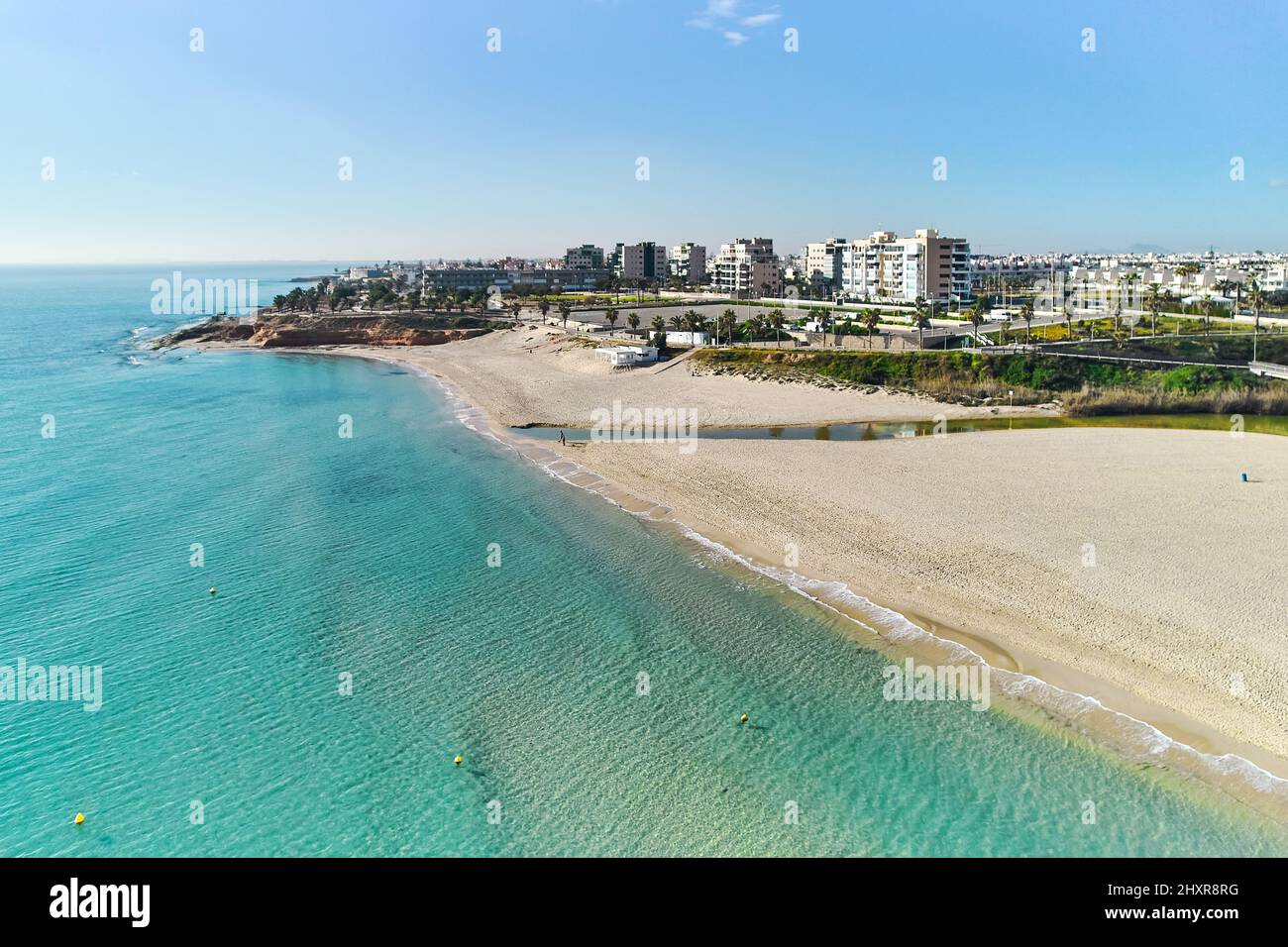 Aerial view of beach and residential houses in Mil Palmeras, Costa