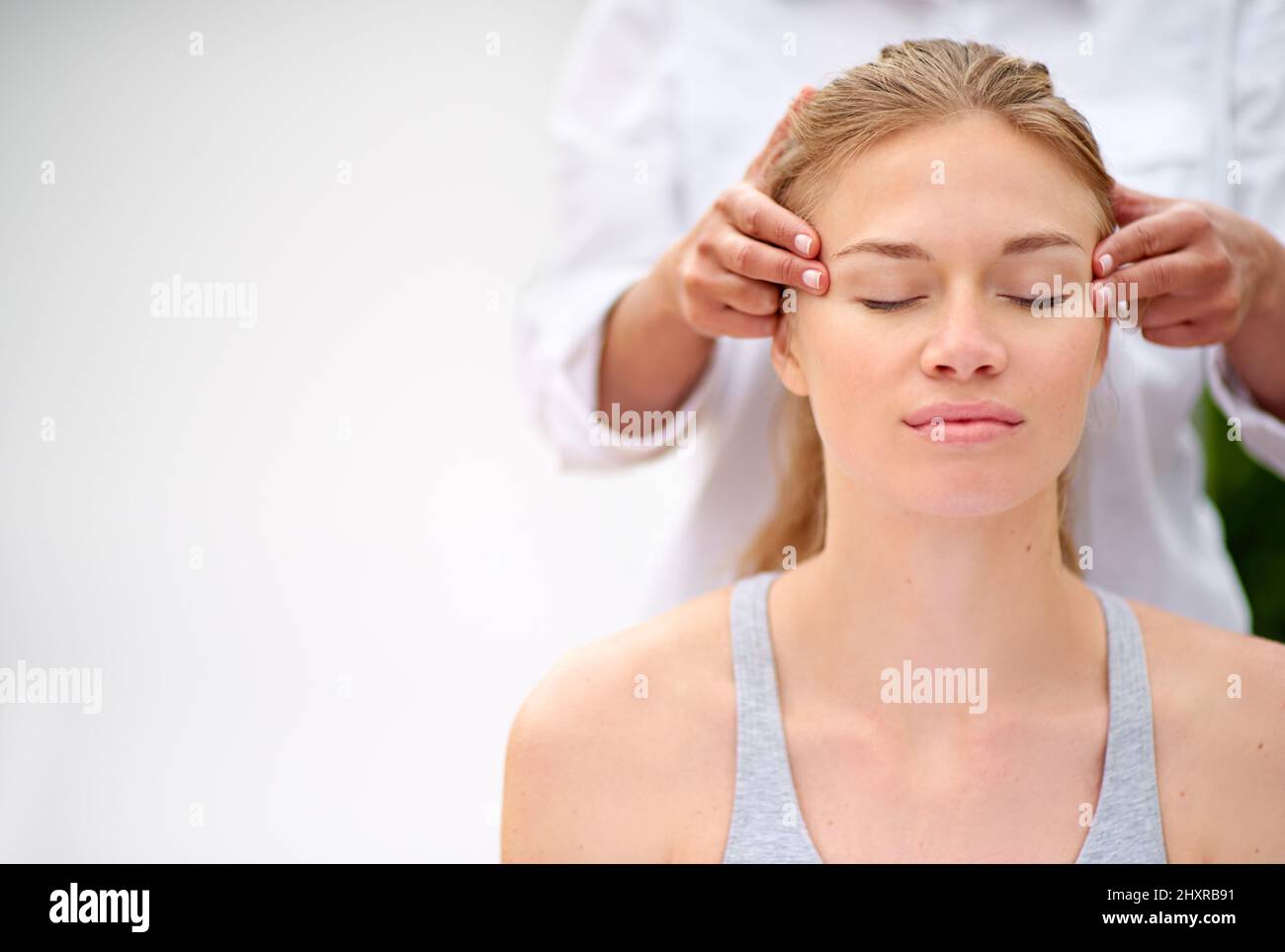 Massaging the stress away. Cropped shot of a young woman enjyoing a