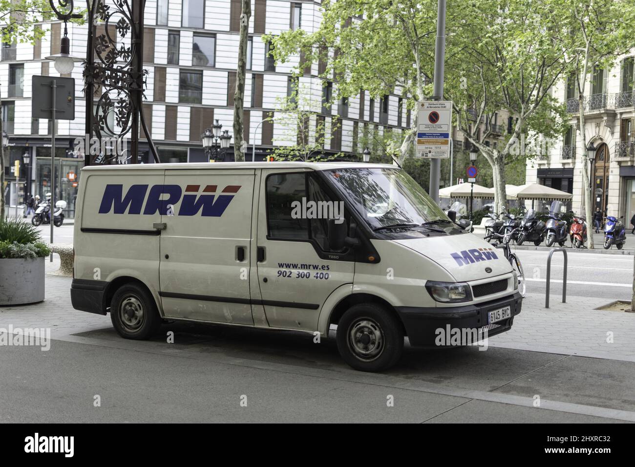 Fourth-generation white T260 Ford Transit - the MRW delivery van parked in the city Stock Photo