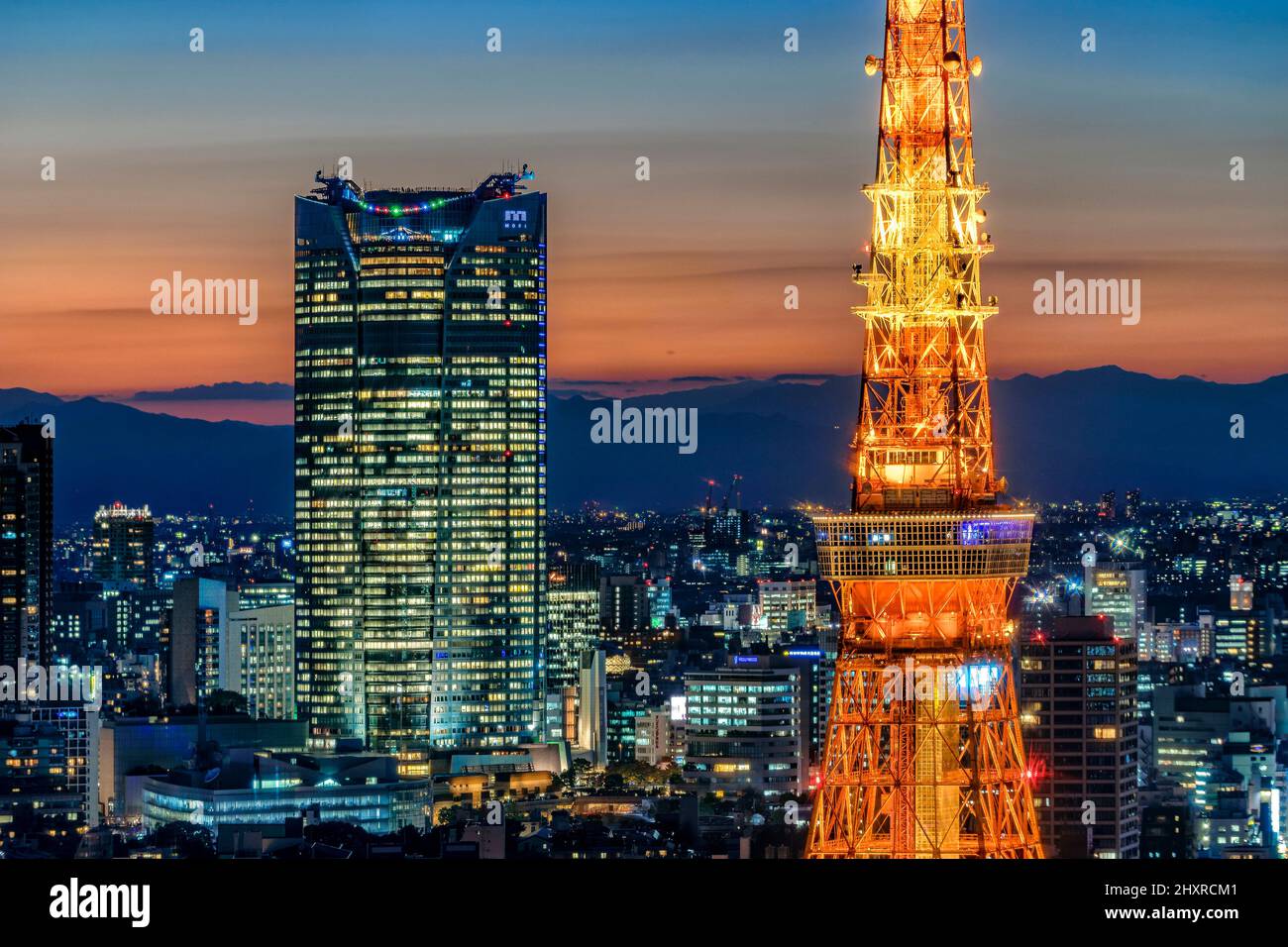 Japan, Honshu island, Kanto, Tokyo, the Tokyo Tower and the Mori Tower at sunset. Stock Photo