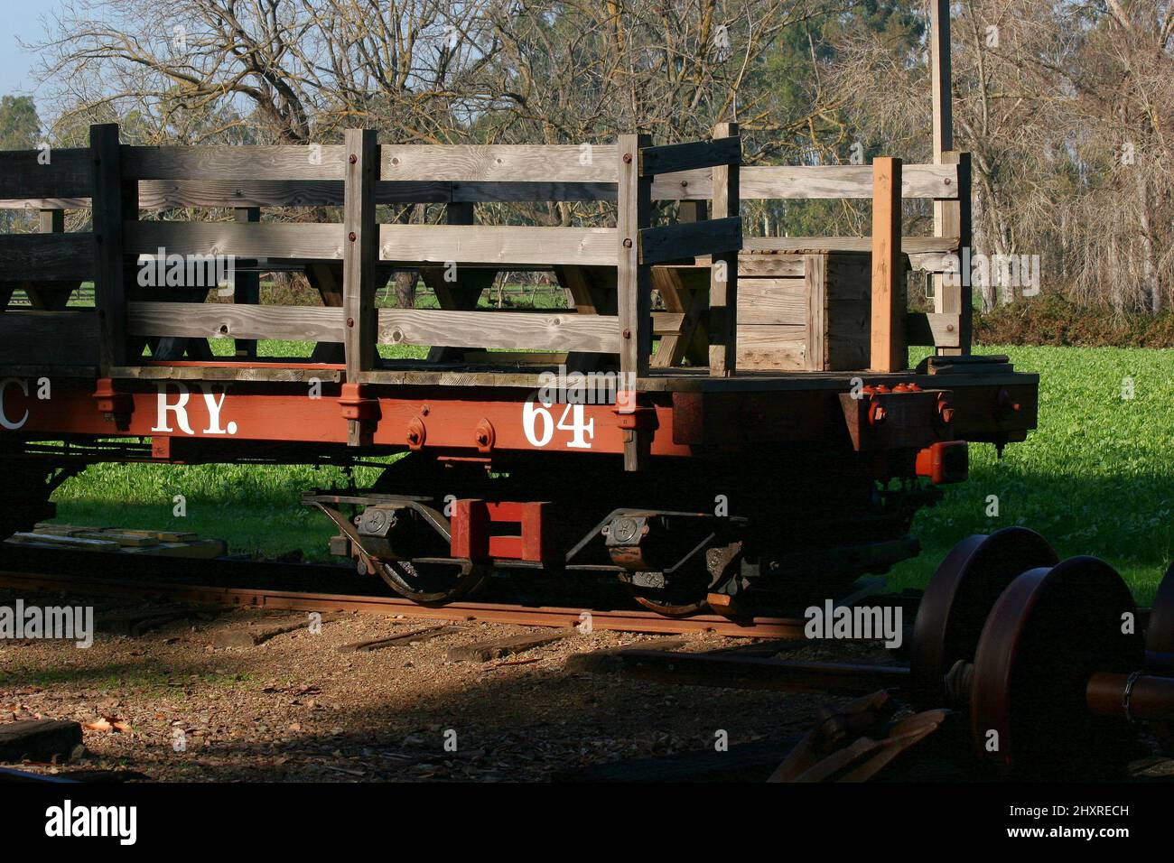 Red Flatbed Railroad Car with Wood Slats on Rural Track Stock Photo Alamy