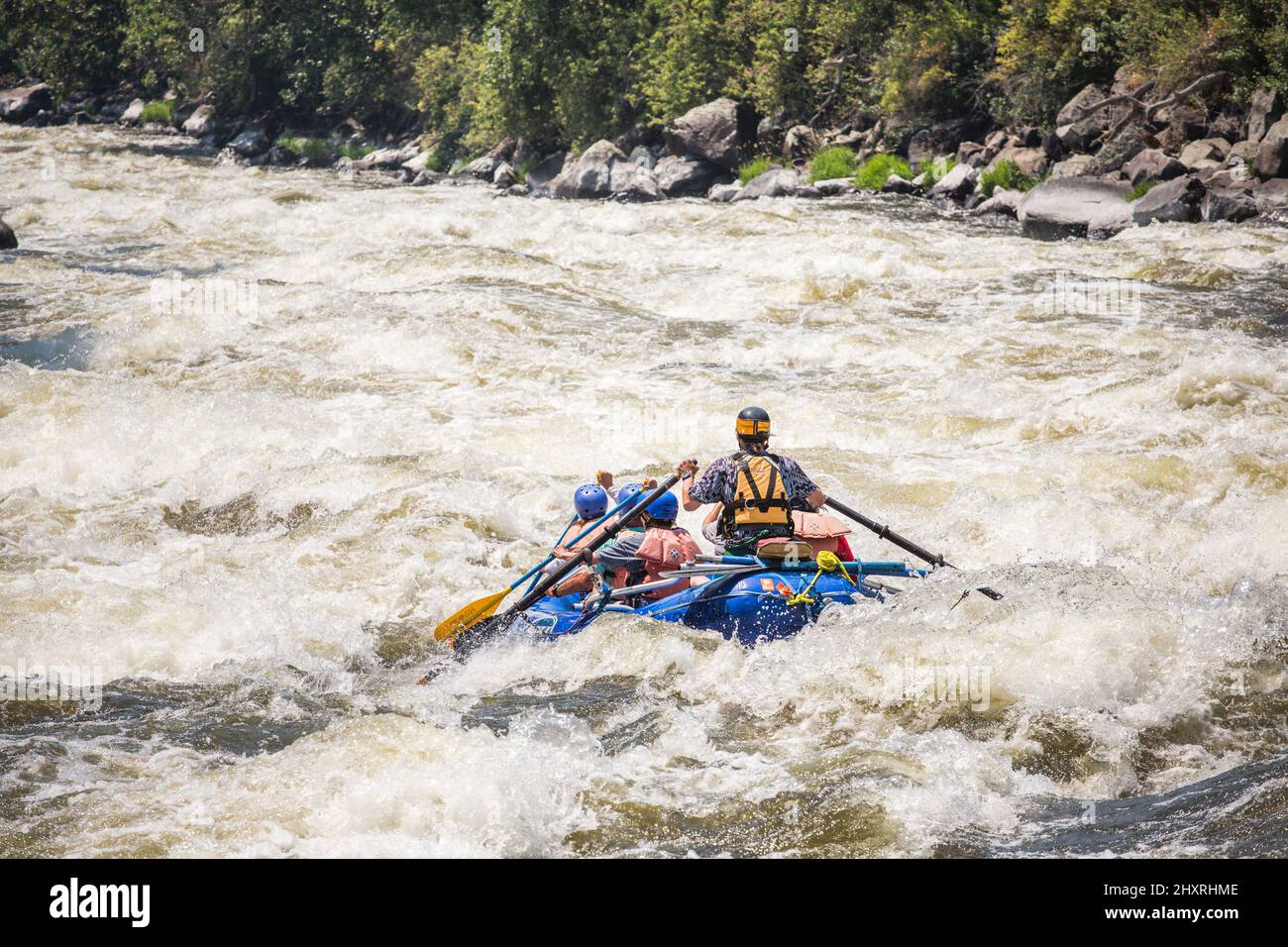 A raft rides into big whitewater Stock Photo Alamy
