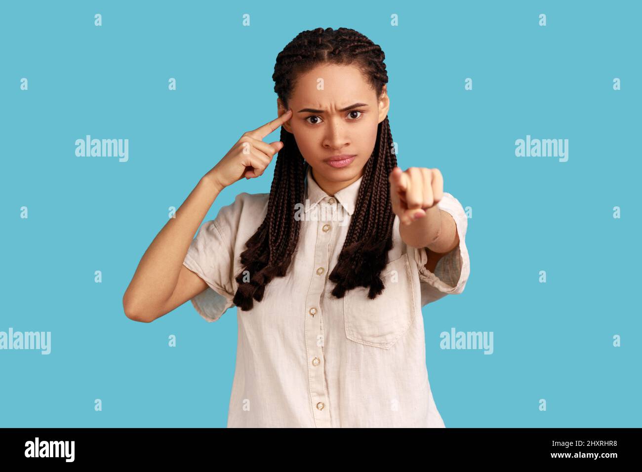 Premium Photo  You are idiot angry woman at workplace making stupid  gesture and pointing to laptop screen having silly senseless talk on video  call accusing dumb mind indoor studio shot isolated