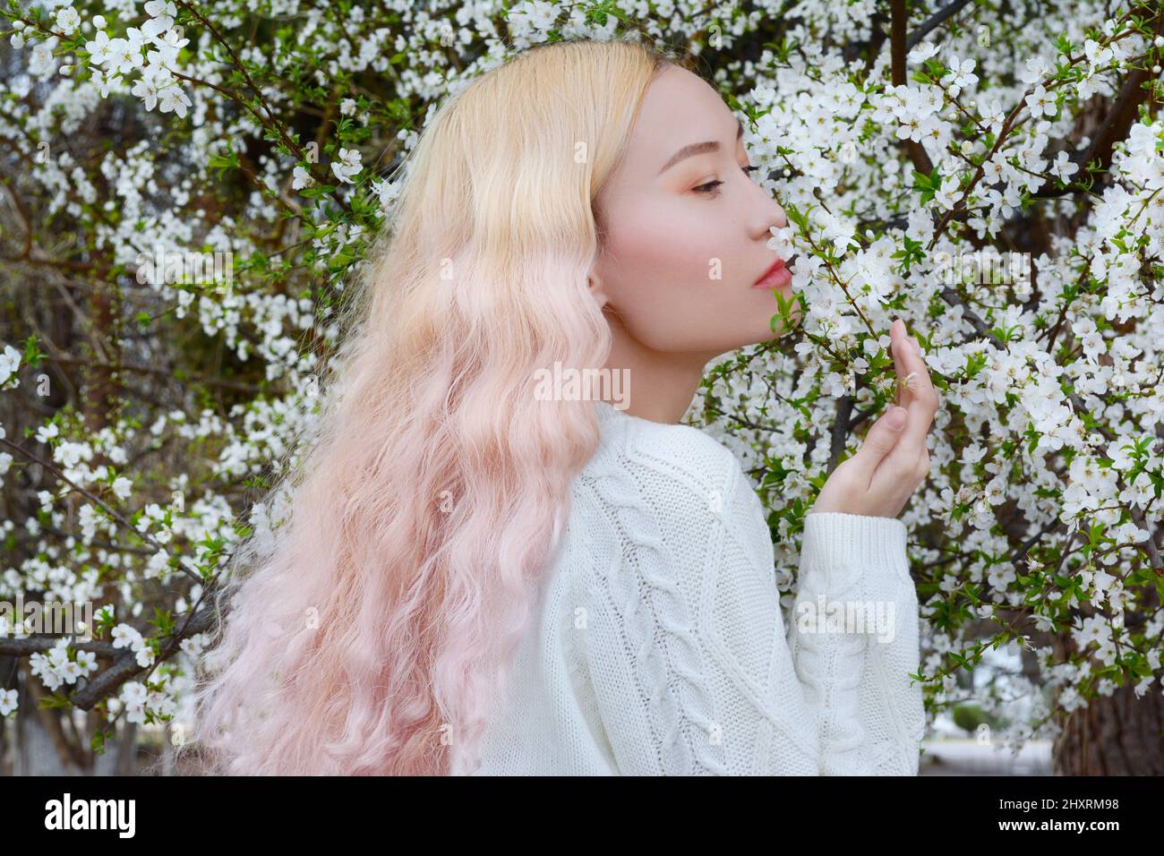 Asian Girl With Spring Flowers Stock Photo Alamy