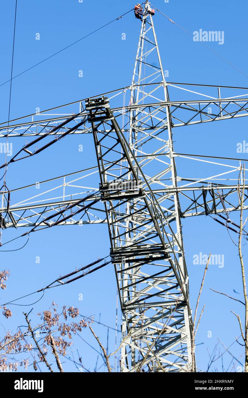 Electricity Tower with power lines under the blue sky Stock Photo - Alamy