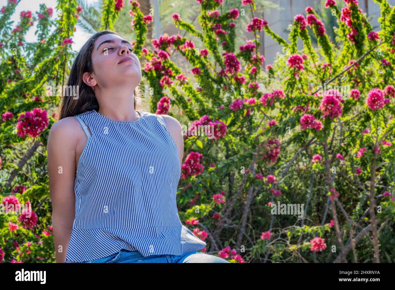 Caucasian female breathing fresh air on the city park Stock Photo - Alamy