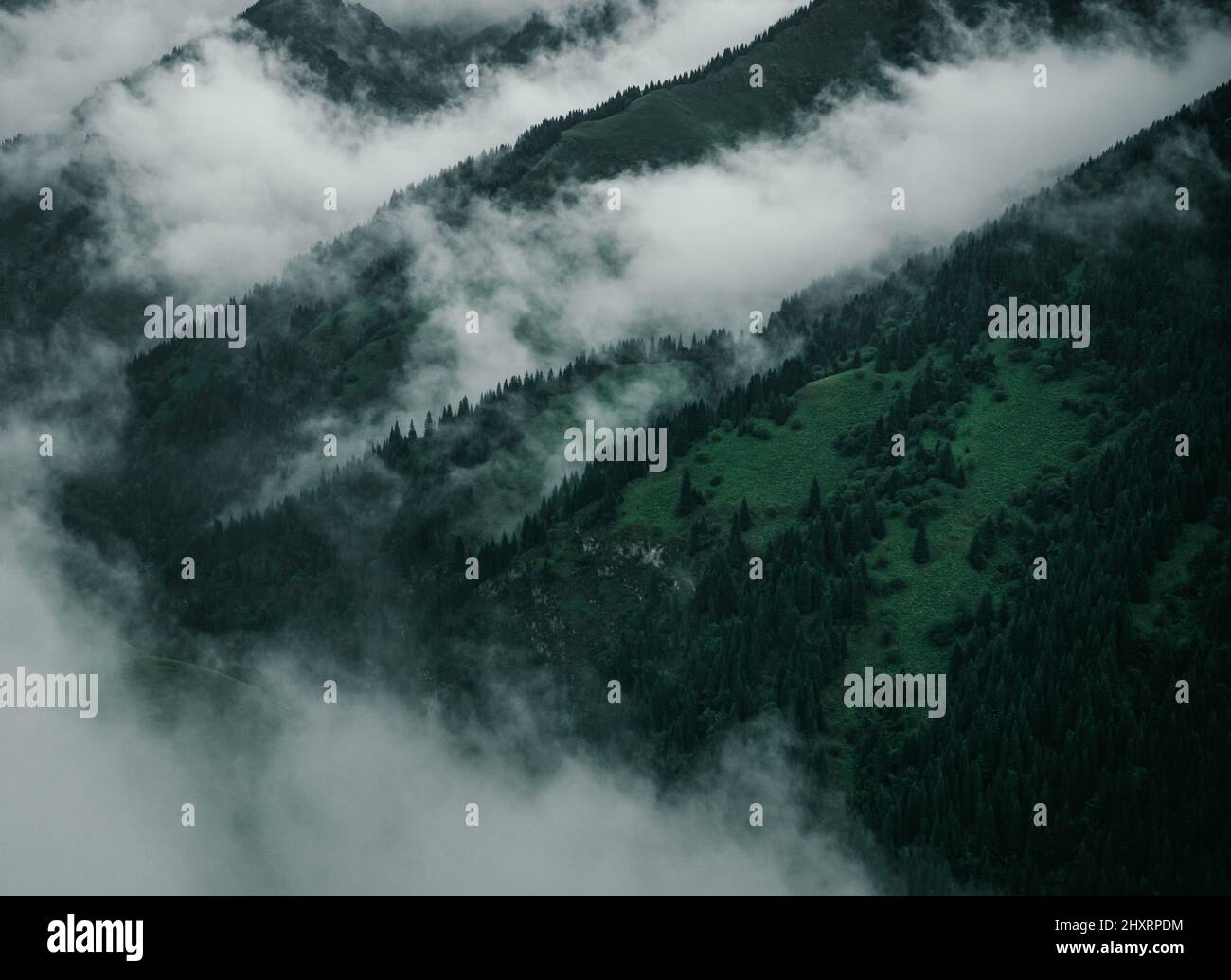 Beautiful shot of mountains in foggy weather in western China Stock ...