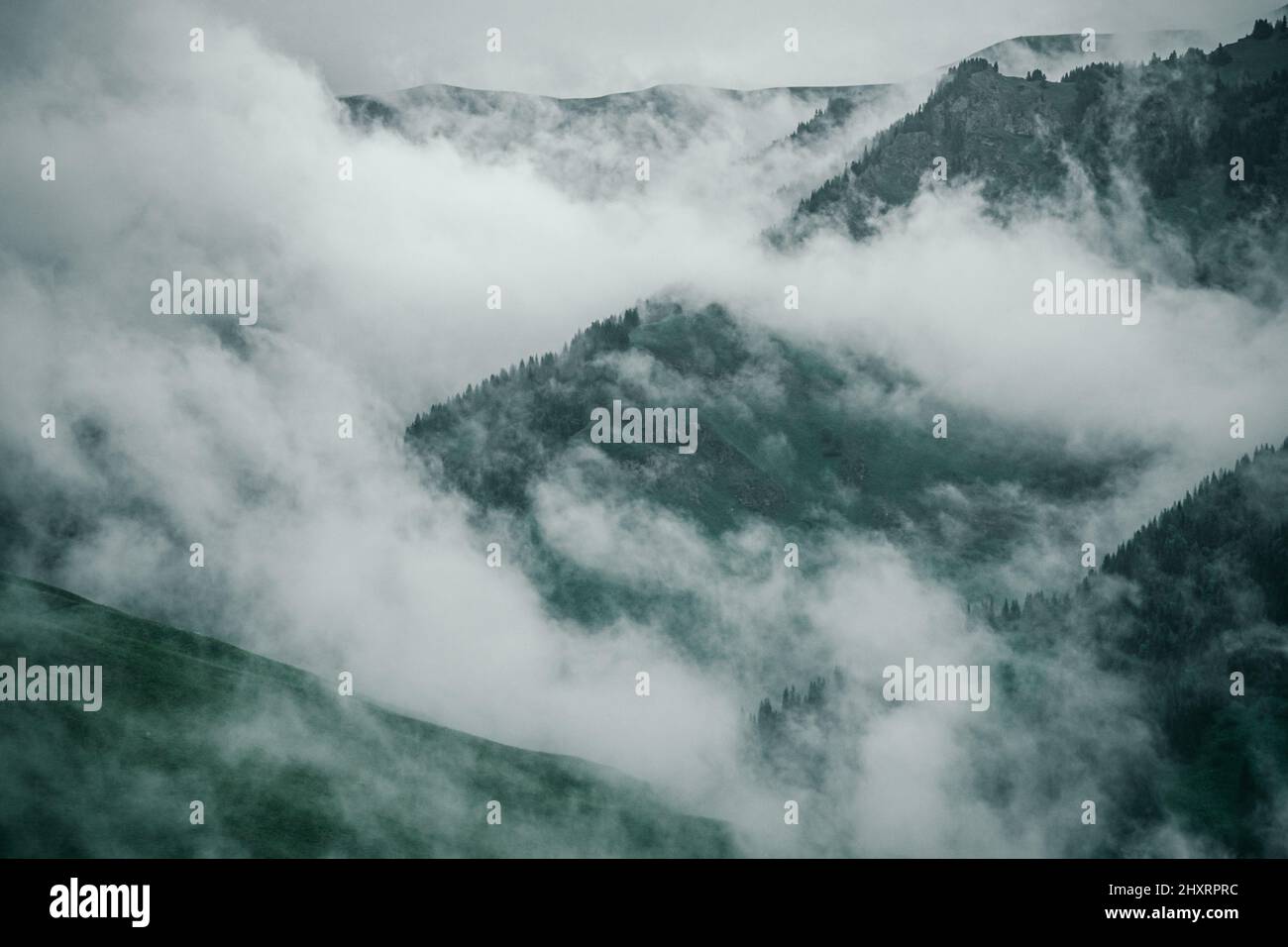 Beautiful shot of mountains in foggy weather in western China Stock ...