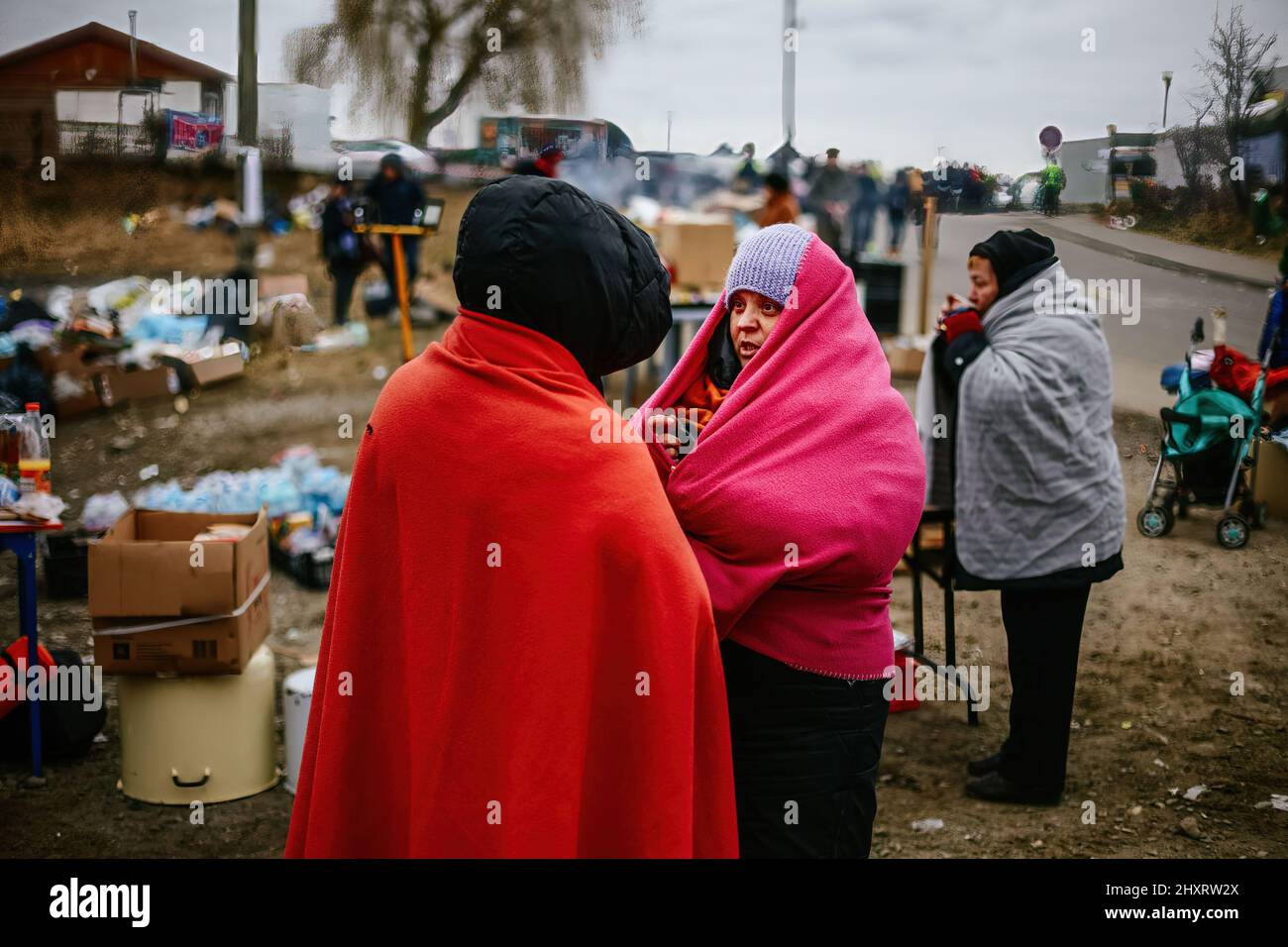 March 6, 2022, Medyka, Poland: Refugees seen covered with blankets for warmth. Polish-Ukrainian border crossing in Medyka. Since the beginning of the Russian invasion of Ukraine, over 1.7 million people have fled to Poland to escape the war. Ukrainian refugees are being welcomed with complex support from both charity organisations and ordinary Poles, but many humanitarian experts indicate that with such a huge influx of people and not enough support from Polish government, a crisis could occur within few weeks. (Credit Image: © Filip Radwanski/SOPA Images via ZUMA Press Wire) Stock Photo