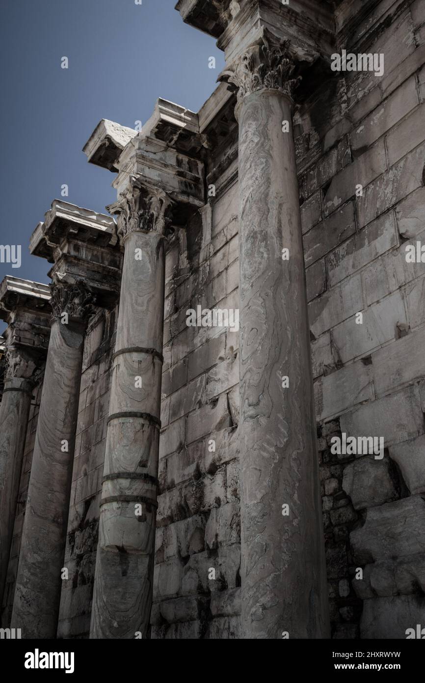 Vertical shot of temple columns of Hadrian's Library Historical