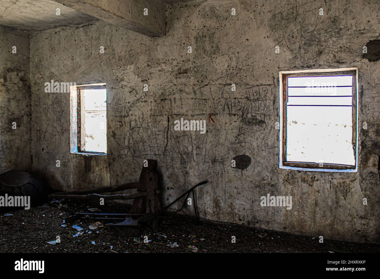 Broken windows of an abandoned building Stock Photo - Alamy