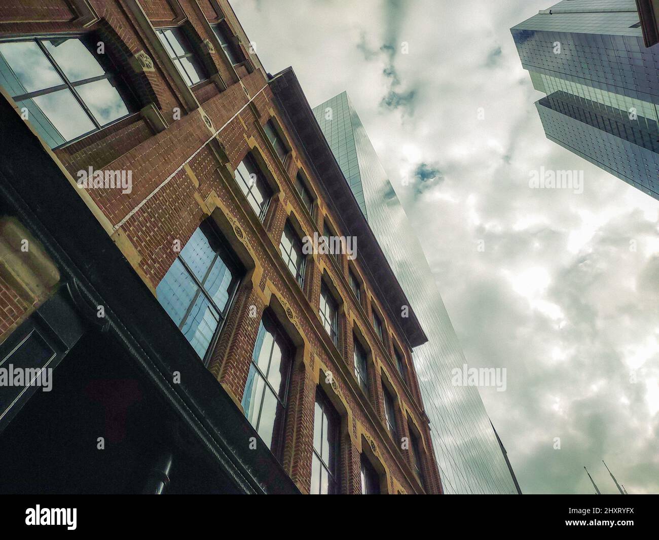 Low angle of buildings in a modern city on a cloudy day Stock Photo - Alamy