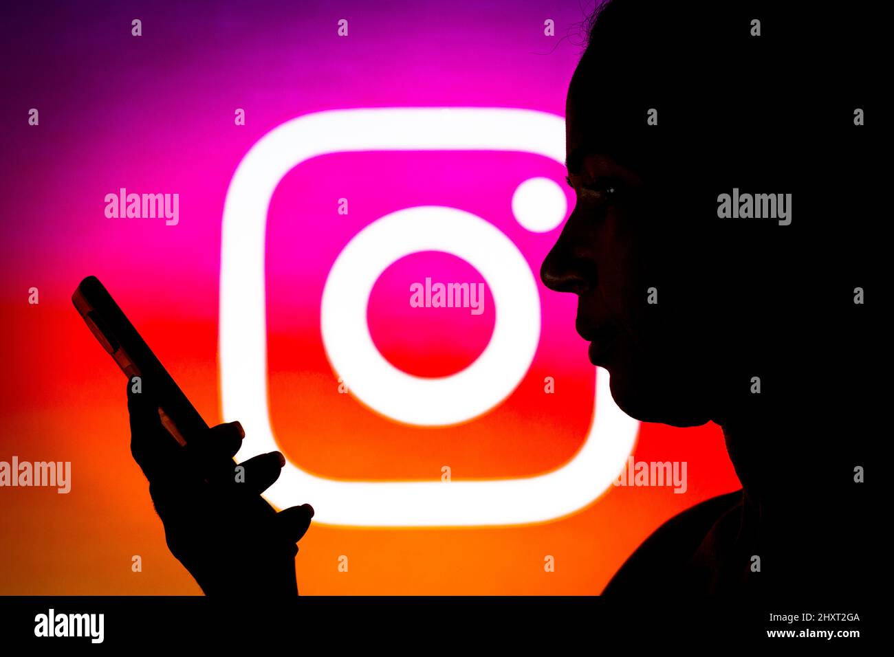 In this photo illustration the Instagram logo seen in the background of