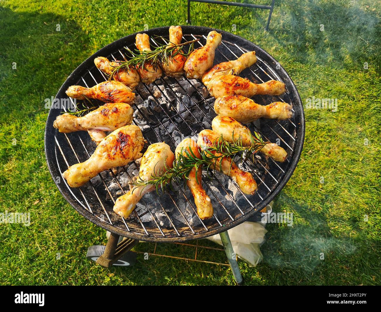 Chicken drumsticks fried with rosemary on a charcoal grill Stock Photo Alamy