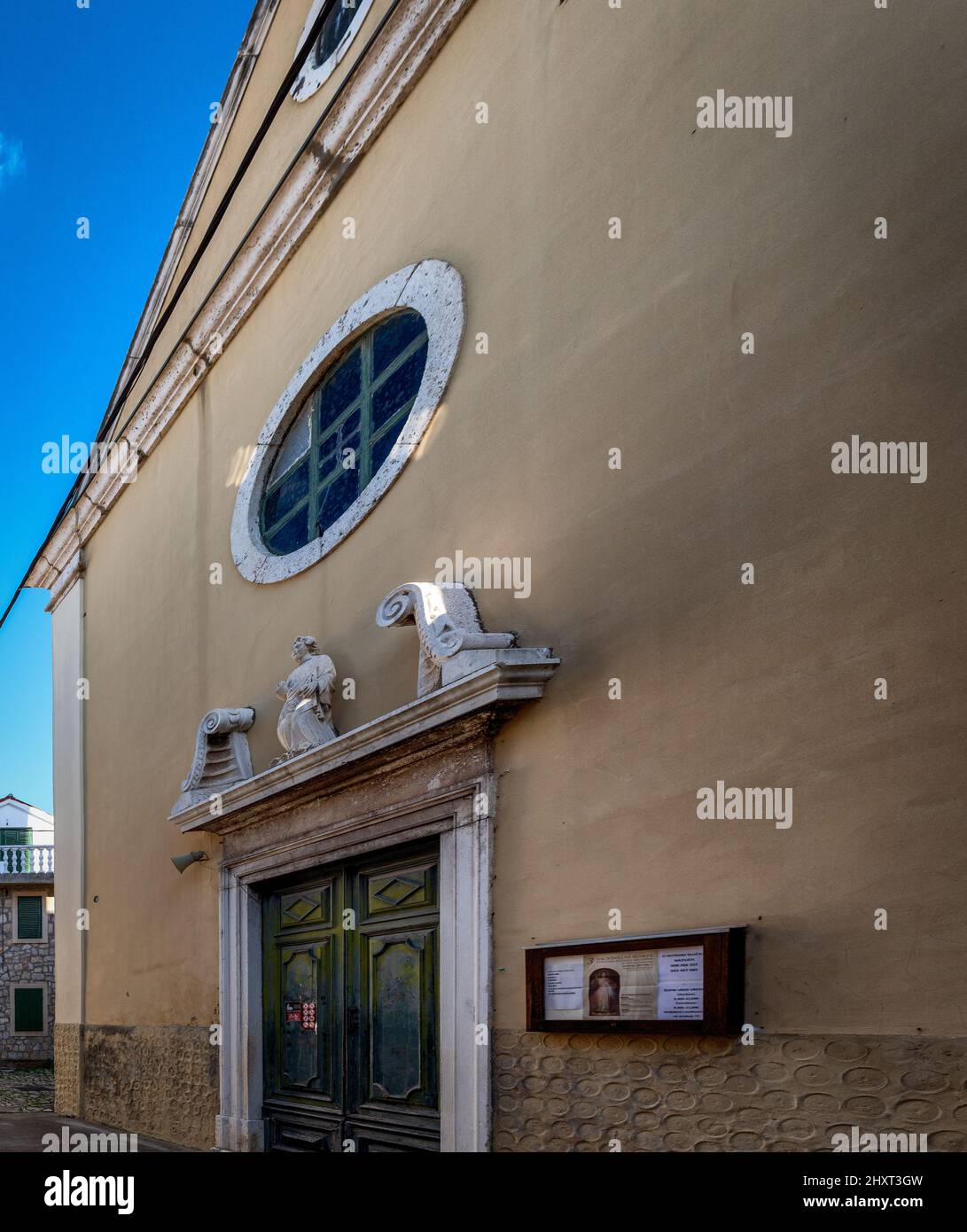 Beautiful view of the facade of an old house with a window and a door ...