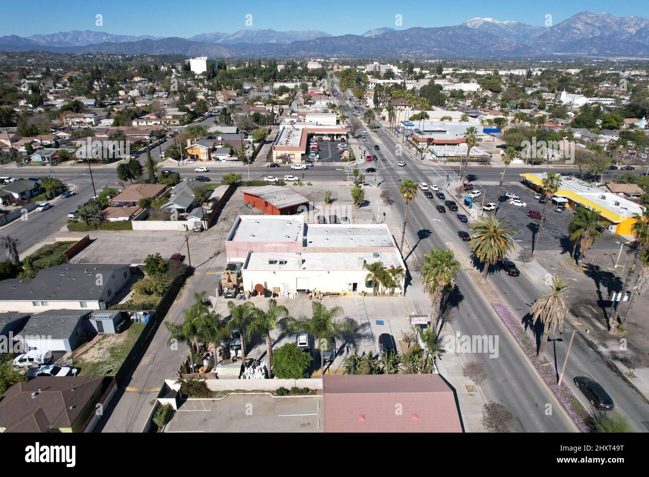 Aerial drone view of the private houses, streets and cars of the city