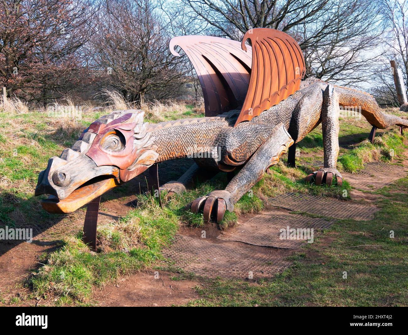 A Carved wooden and steel sculpture of a dragon  at North Yorkshire Moors Centre Danby Stock Photo