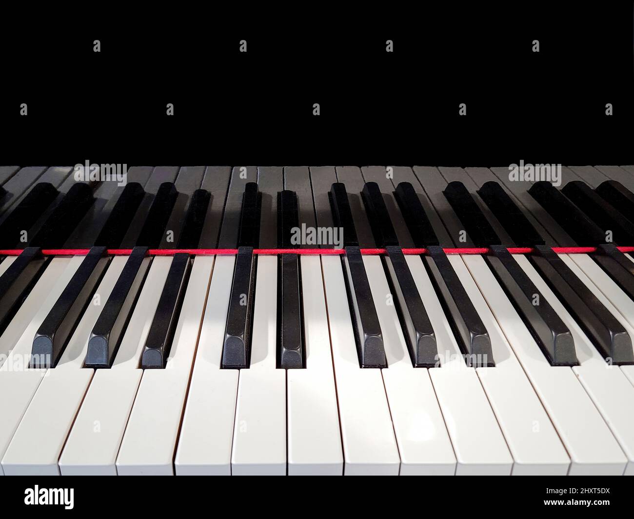 Close up of piano keyboard with shiny black reflection Stock Photo Alamy