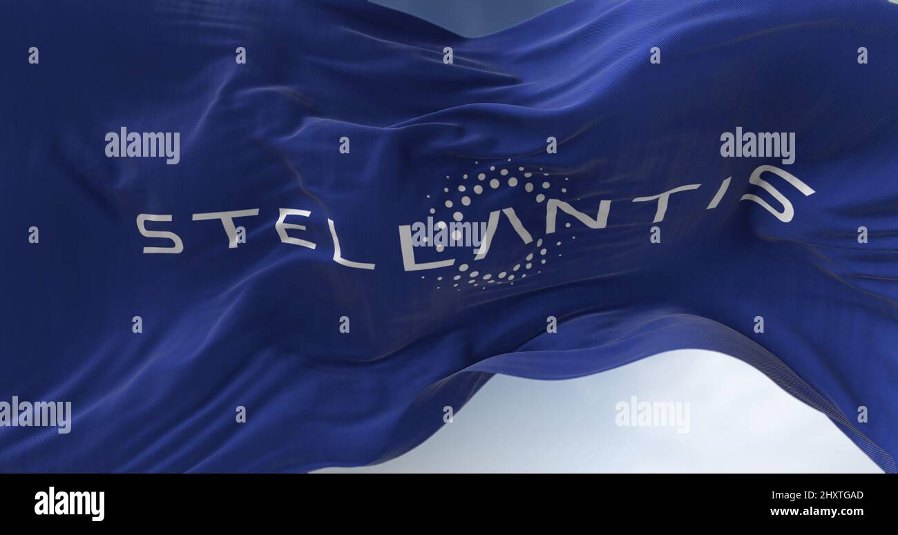 Amsterdam, Holland, March 2022: Close-up view of the blue flag with the Stellantis logo waving in the wind. Stellantis is a Dutch multinational motor Stock Photo