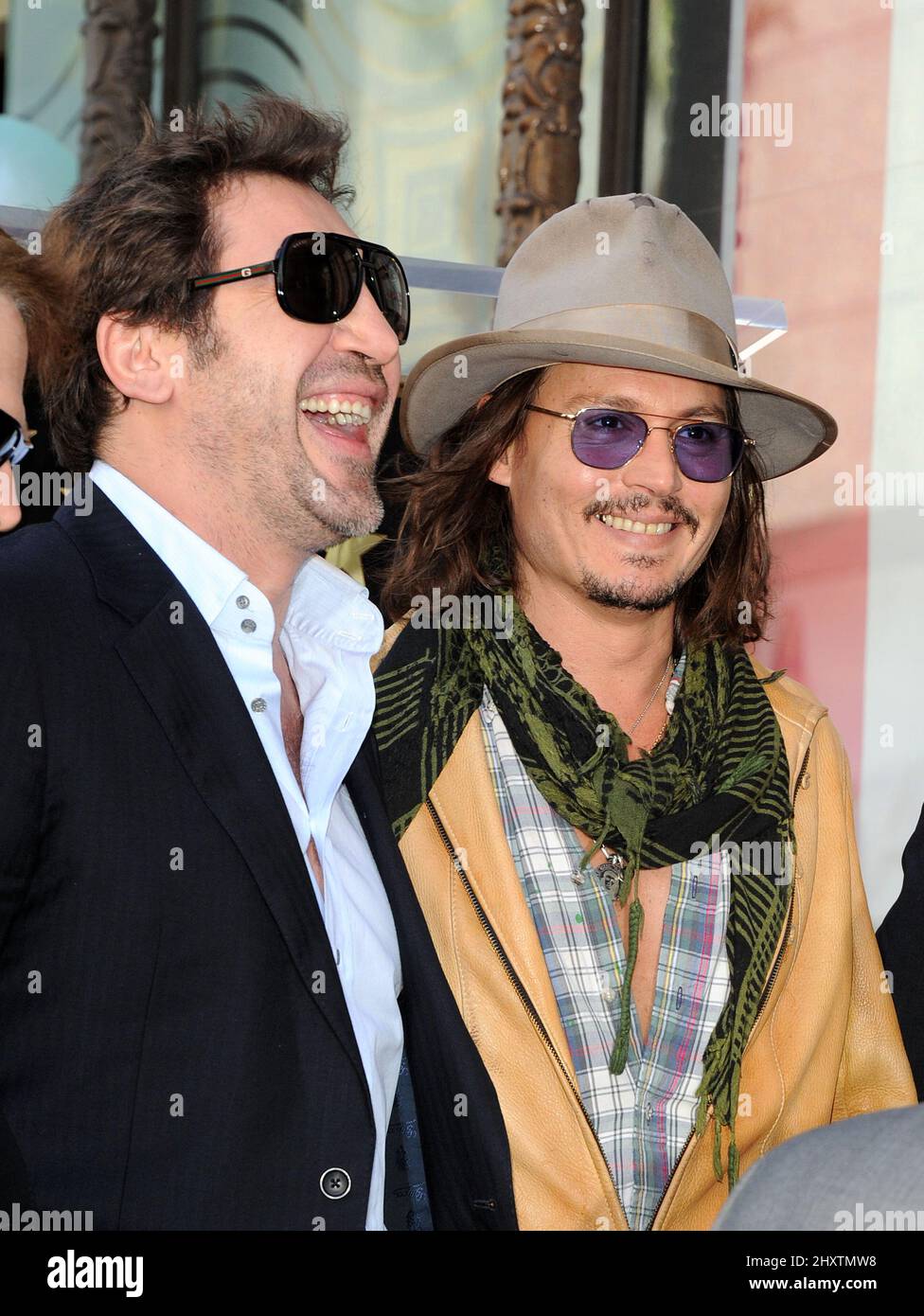 Javier Bardem and Johnny Depp as Penelope Cruz is honored as the first spanish born actress to receive a star on the Hollywood Walk of Fame on April 1, 2011 in Hollywood, California. Stock Photo