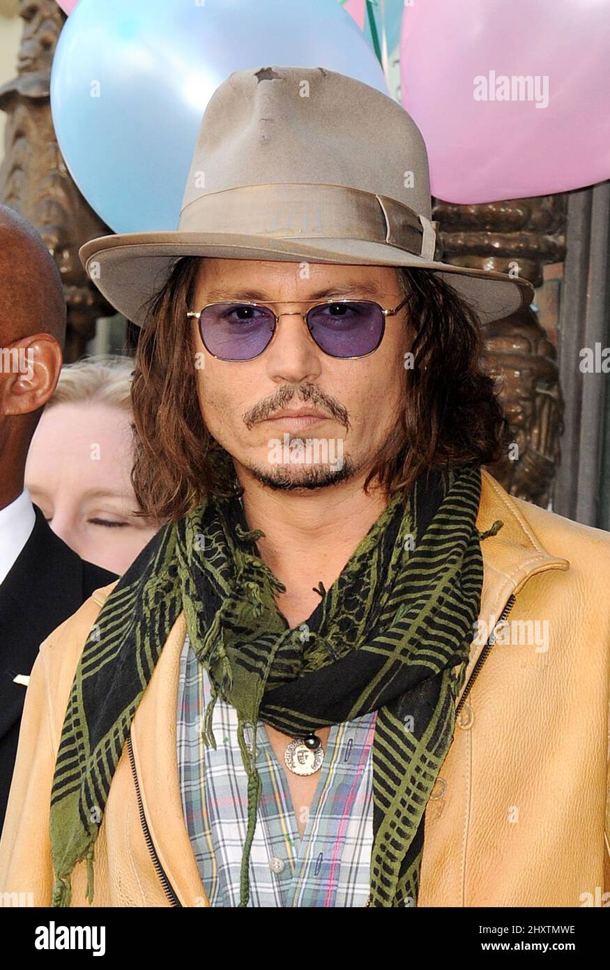 Johnny Depp as Penelope Cruz is honored as the first spanish born actress to receive a star on the Hollywood Walk of Fame on April 1, 2011 in Hollywood, California. Stock Photo