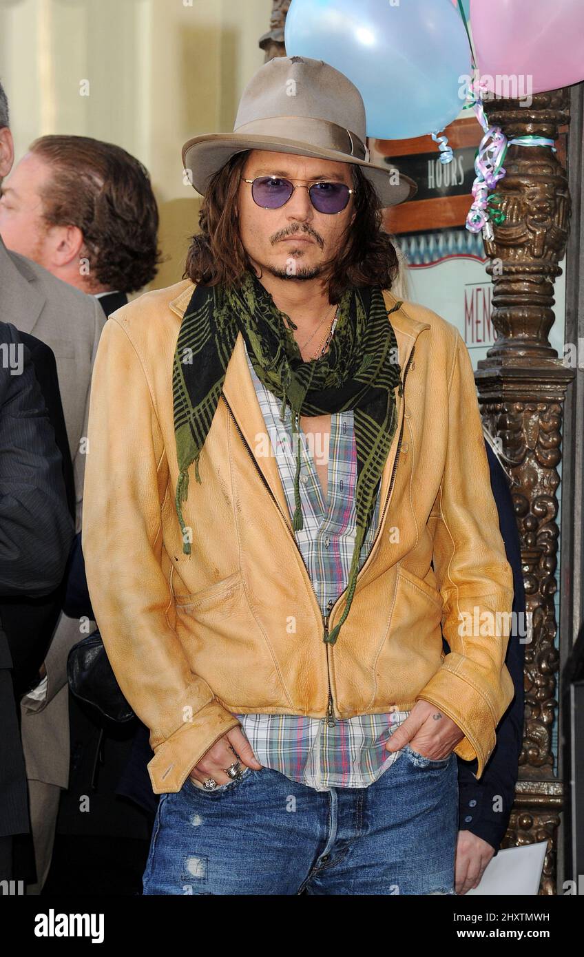 Johnny Depp as Penelope Cruz is honored as the first spanish born actress to receive a star on the Hollywood Walk of Fame on April 1, 2011 in Hollywood, California. Stock Photo
