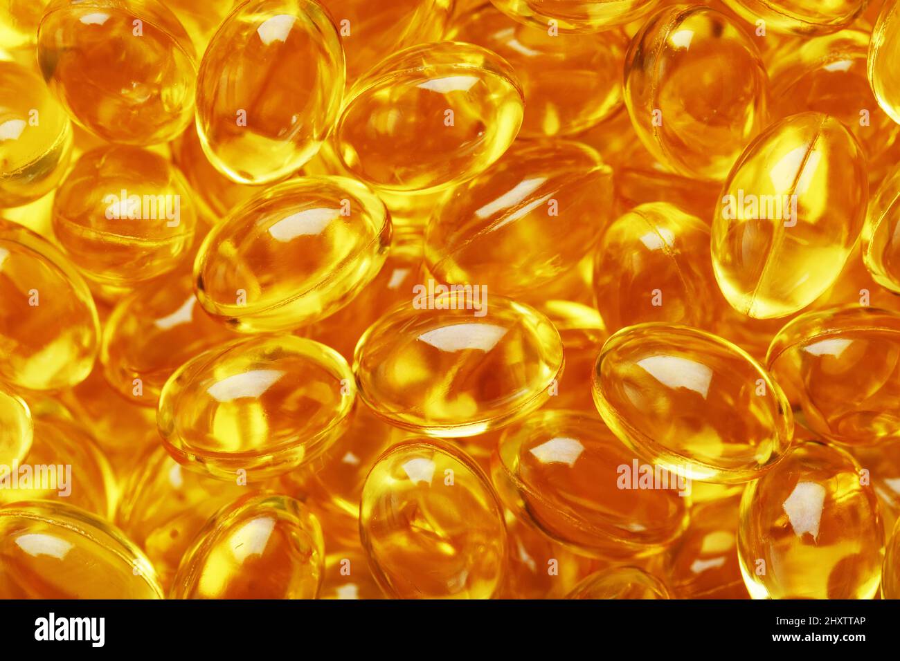 Golden Vitamin D3 Capsules closeup in full screen.The most important
