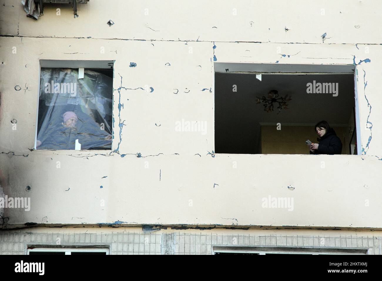 Kiev, Ukraine - March 14, 2022 - Residents are seen inside a destroyed ...