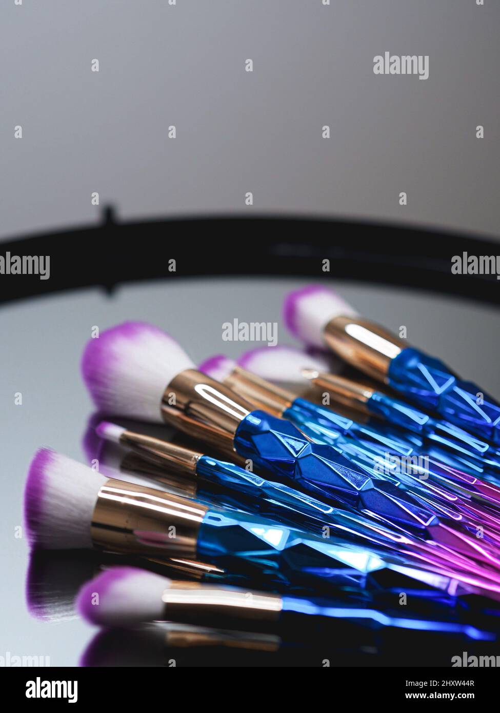 Colorful brushes for makeup with the reflection on the mirror Stock Photo Alamy