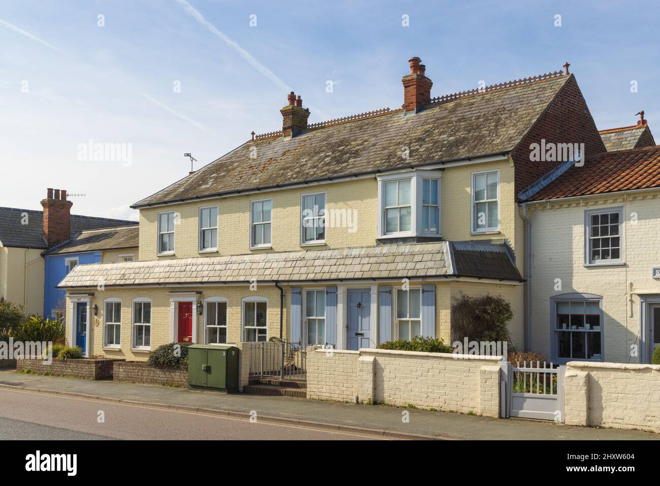 Yellow terraced houses on Aldeburgh High Street. UK Stock Photo