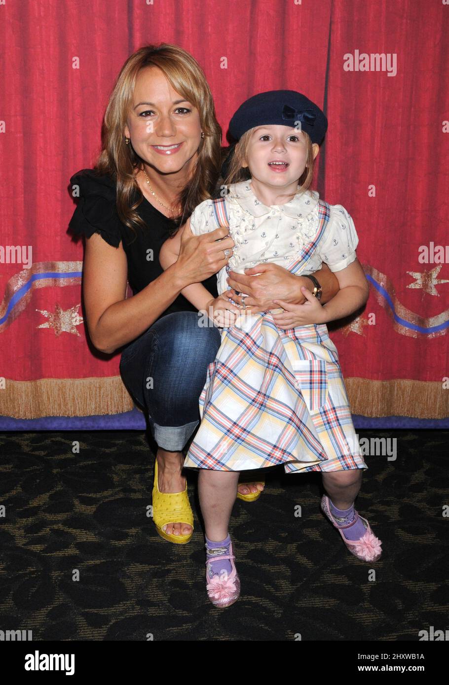 Megyn Price and daughter Grace at Ringling Bros. & Barnum and Bailey & Starlight Children's Foundation's premiere of 'Fully Charged' at Staples Center on July 21, 2011 in Los Angeles, California. Stock Photo