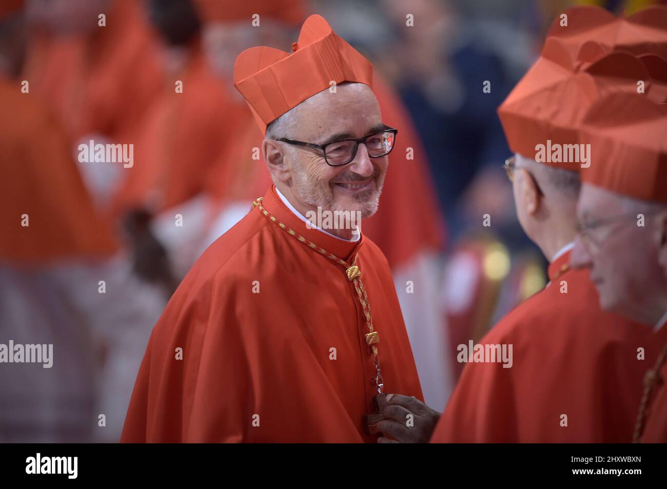 Cardinal Michael Czerny chose a cross made with wood from the cross as a coat of arms, it comes from a boat used to cross the Mediterranean sea and arrive to Lampedusa by migrants. The plaque behind shows the word Suscipe, which means to receive. Pope Francis appoints 13 new cardinals at the 2019 Ordinary Public Consistory, choosing prelates whose lifelong careers reflect their commitment to serve the marginalized and local church communities, hailing from 11 different nations and representing multiple religious orders. Stock Photo