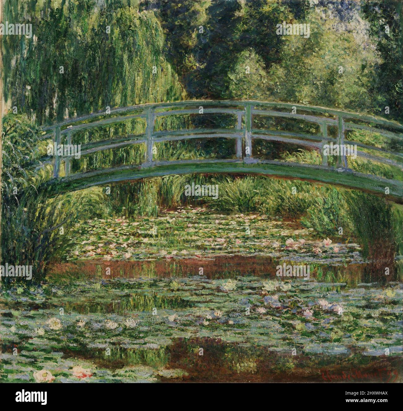 The Japanese Footbridge and the Water Lily Pool Giverny oil on canvas painting by impressionist Claude Monet created in 1899 Stock Photo