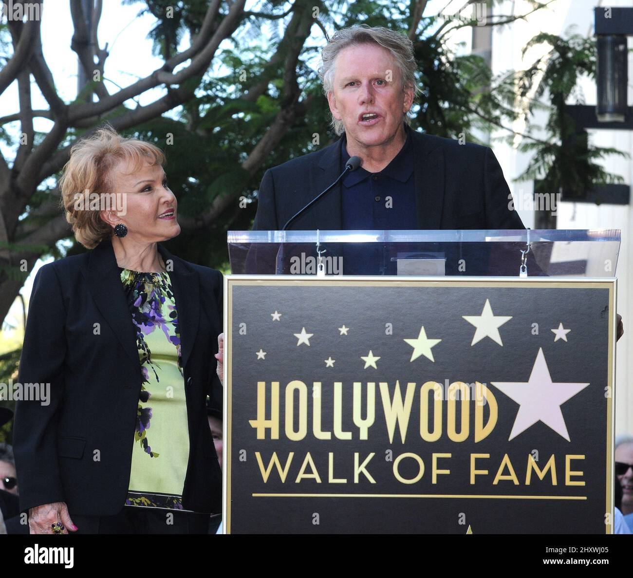 Maria Elena Holly and Gary Busey as Buddy Holly is honored on the Hollywood Walk of Fame in front of the Capital Records Building, Hollywood, California on September 07, 2011. Stock Photo