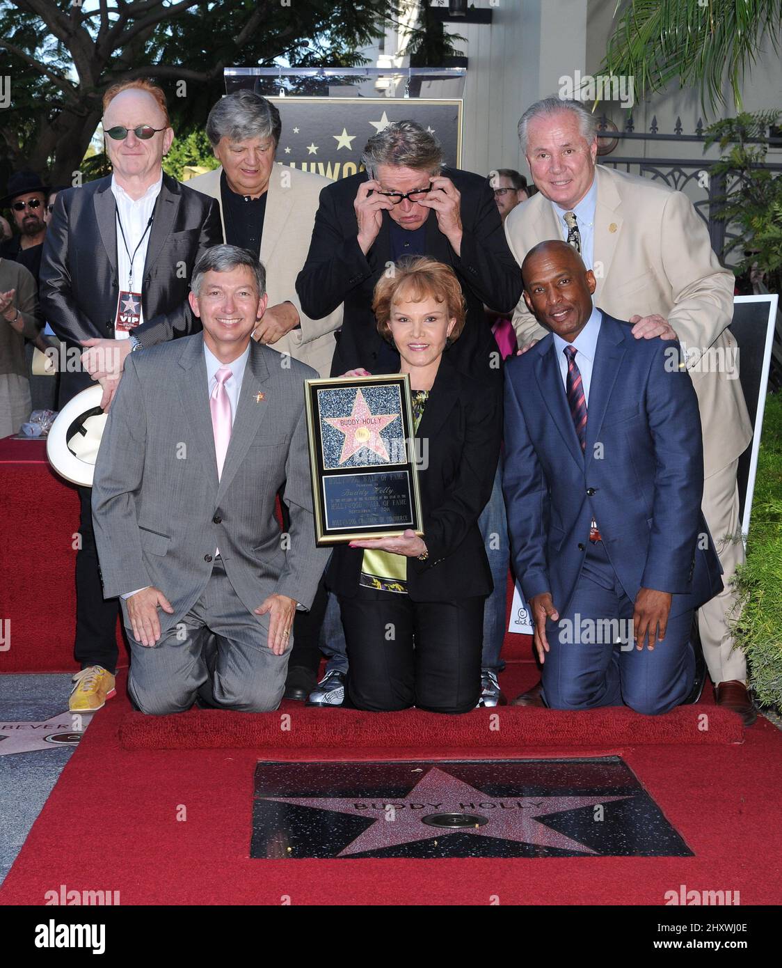 Peter Asher, Leron Gubler, Phil Everly, Gary Busey, Maria Elena Holly, Tom LaBonge and Marty Shelton pose as Buddy Holly is honored on the Hollywood Walk of Fame in front of the Capital Records Building, Hollywood, California on September 07, 2011. Stock Photo