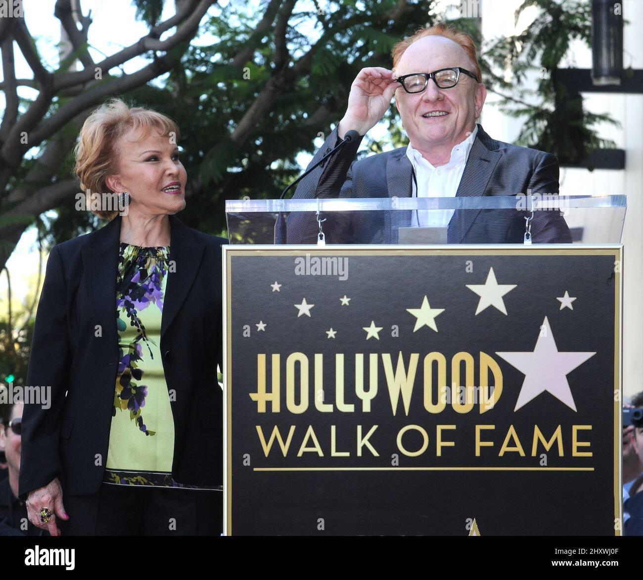 Maria Elena Holly and Peter Asher as Buddy Holly is honored on the Hollywood Walk of Fame in front of the Capital Records Building, Hollywood, California on September 07, 2011. Stock Photo