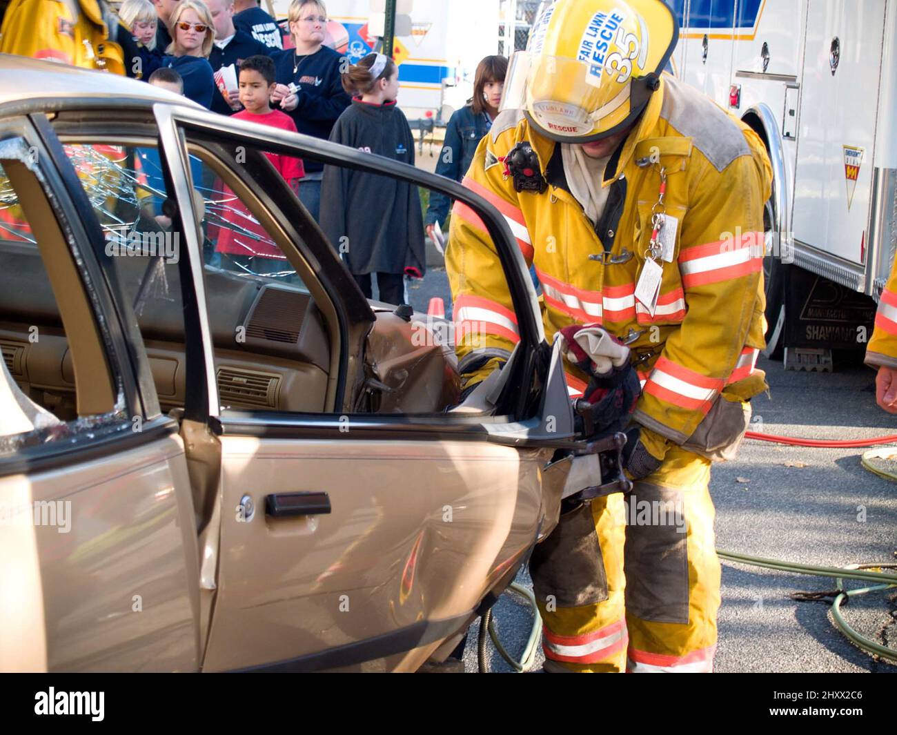 Rescue worker with wrecked car during drill Stock Photo - Alamy