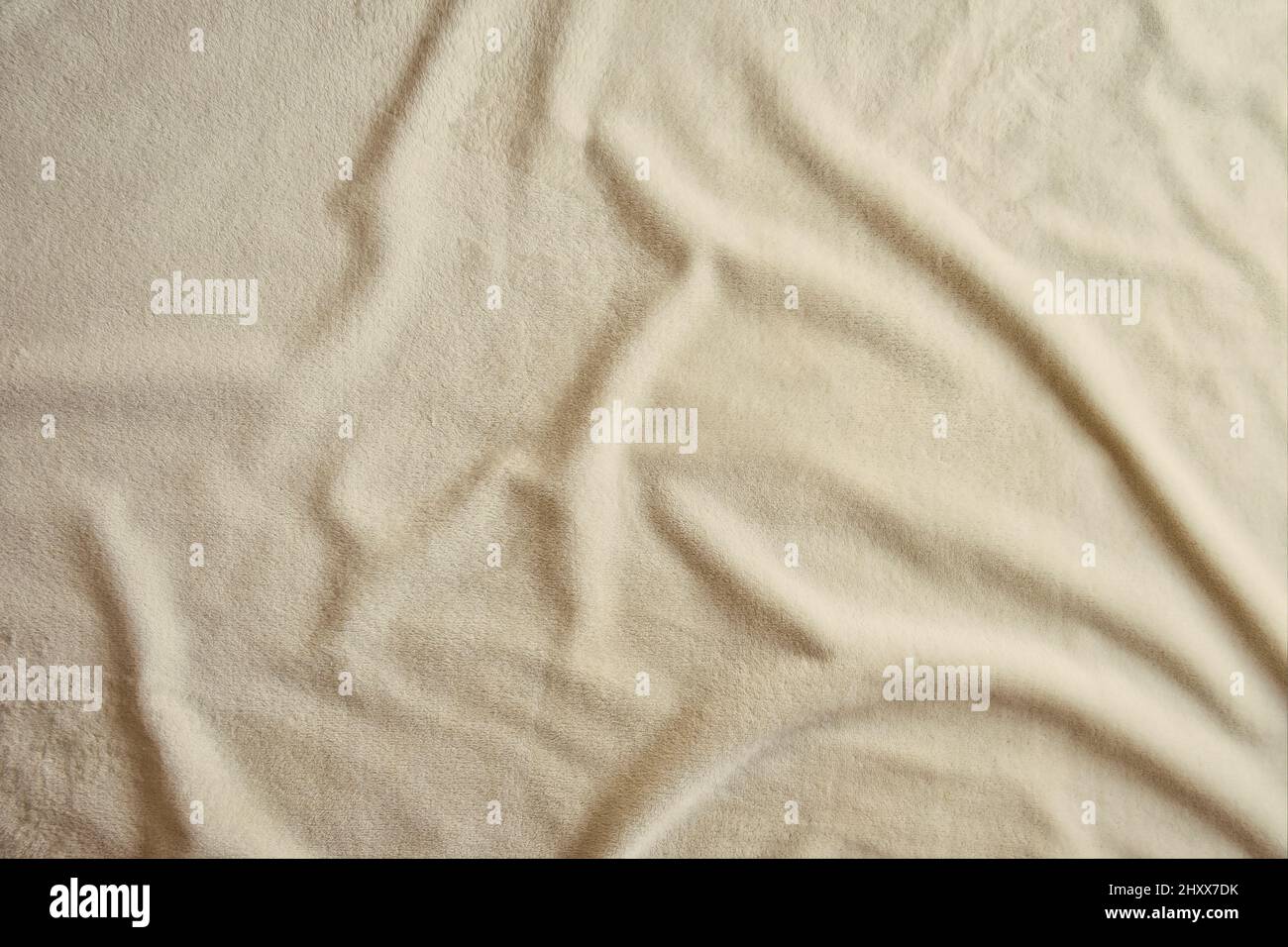 Fluffy Gentle baby pastel pink rose fabric with waves and folds. Soft  pastel textile texture. Folds on the soft fabric. Rose towel terry cloth.  Stock Photo