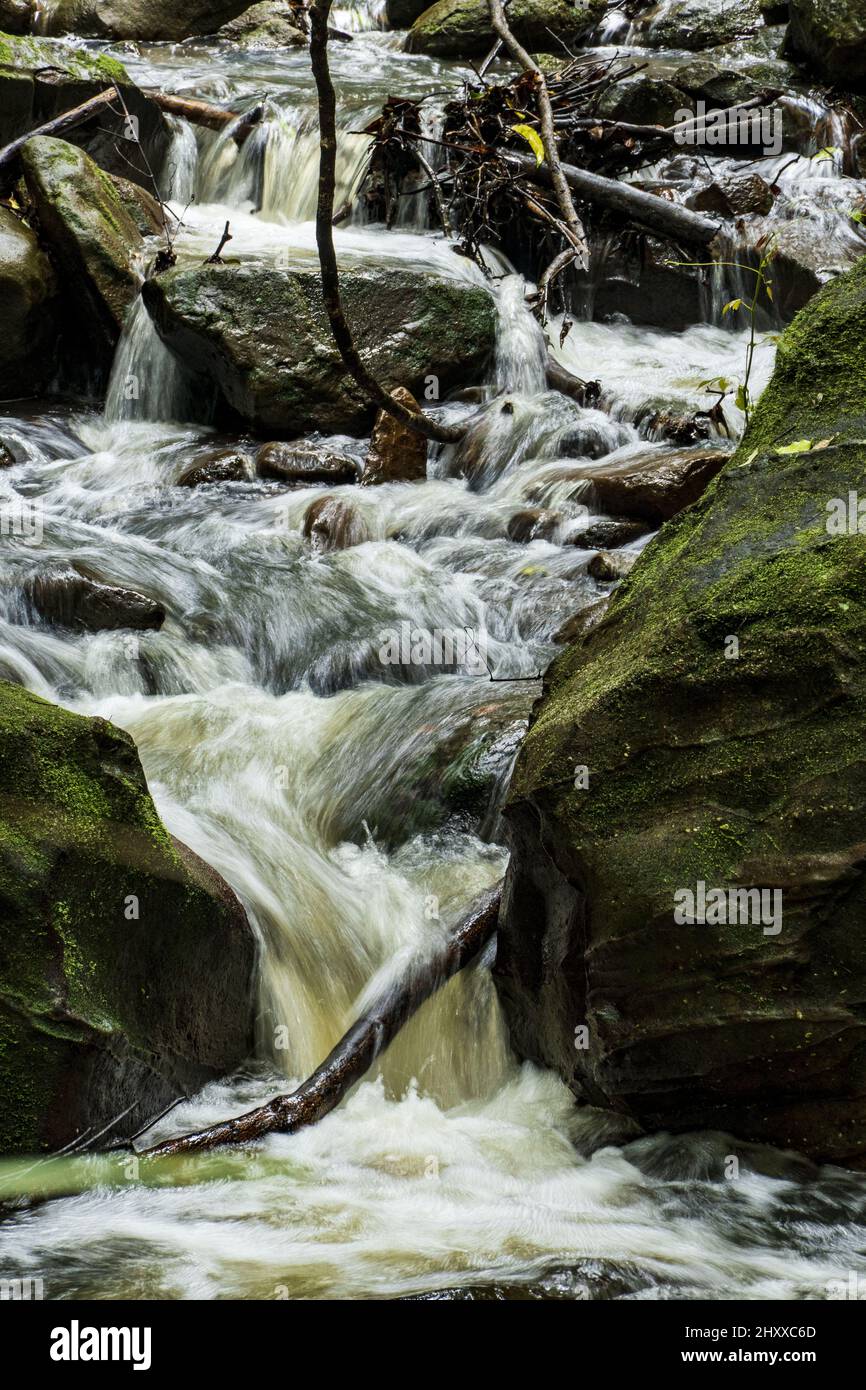 Water flowing down between rocks hi-res stock photography and images ...
