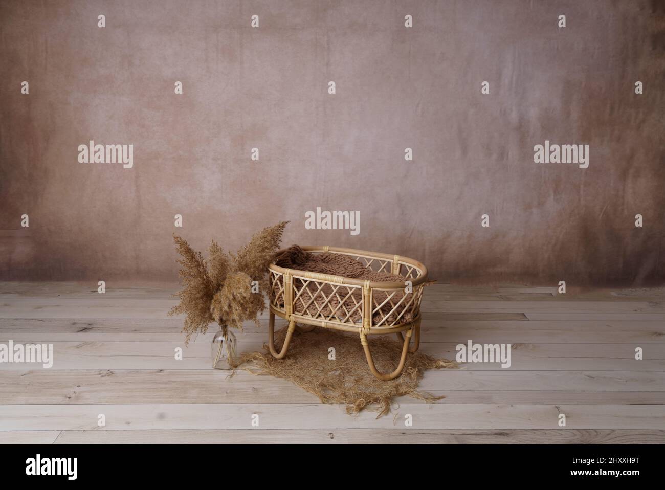 Closeup of a wicker cradle in a room Stock Photo Alamy