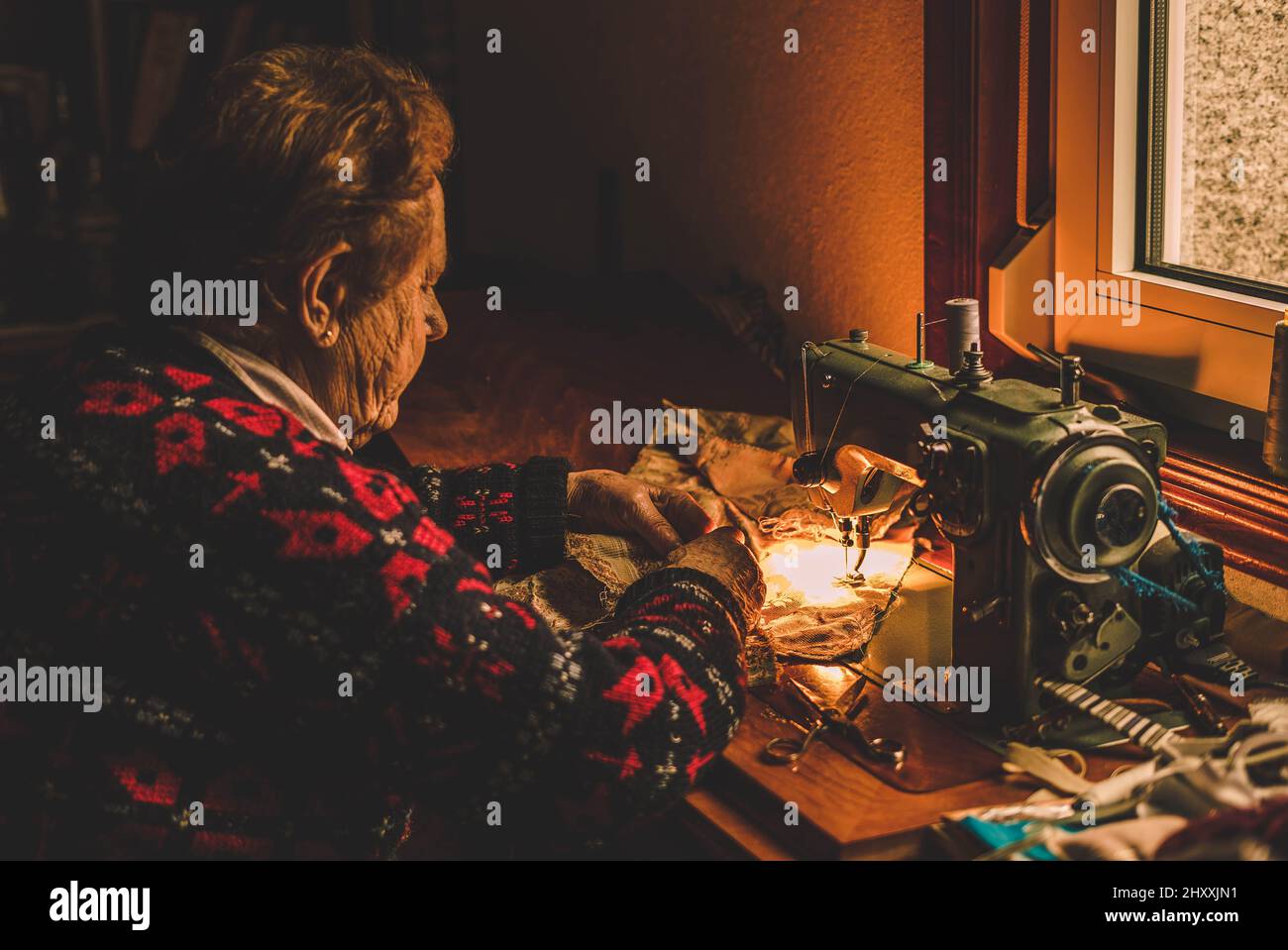 Female sewing machine sews hi-res stock photography and images - Alamy