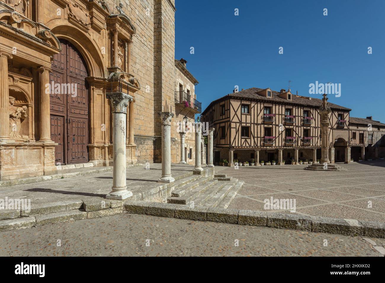 Medieval houses and the Ex Collegiate Santa Ana in the Main Square of Pena Aranda de Duero. Burgos. Spain. Stock Photo