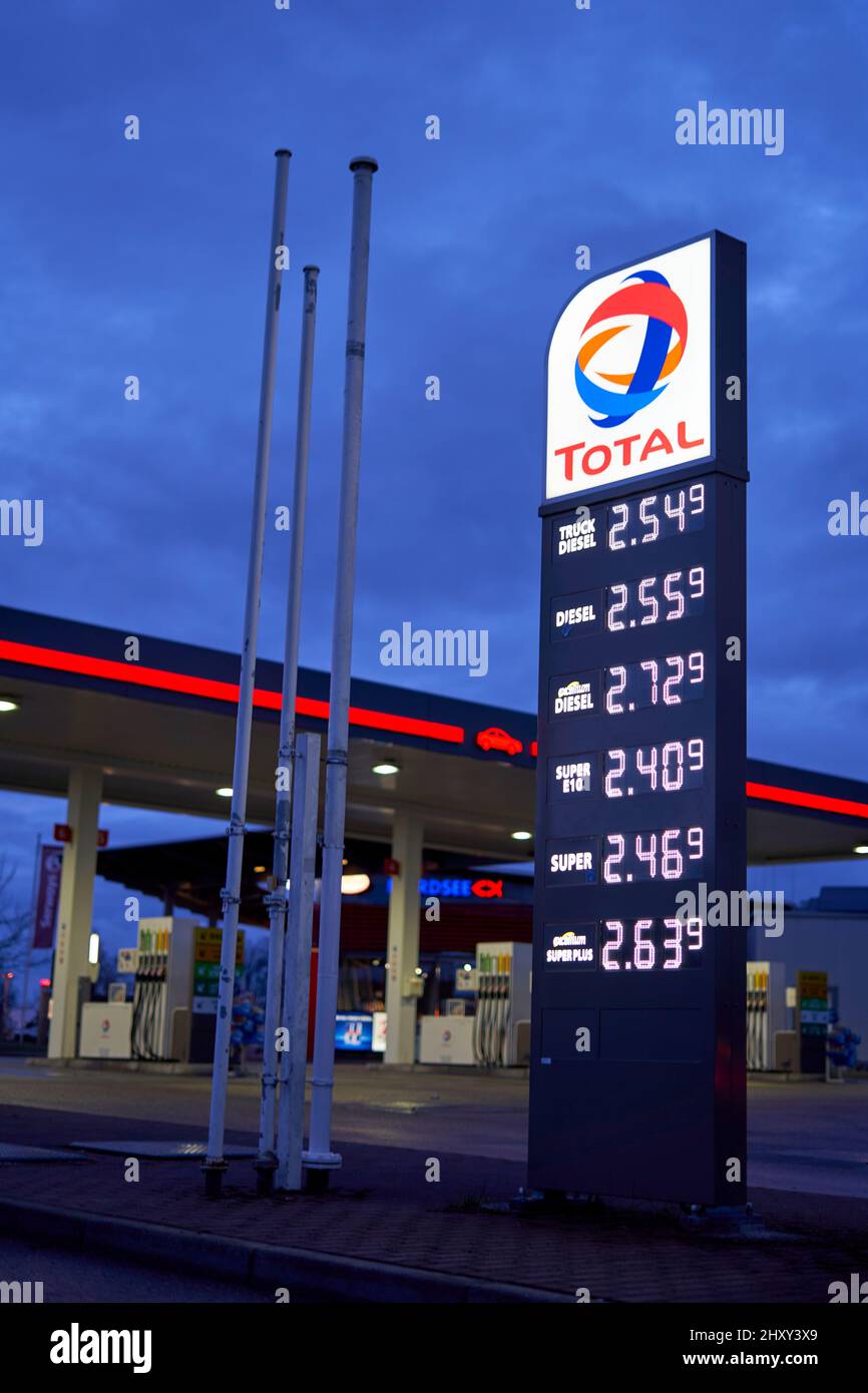 Denkendorf, Germany - March 14, 2022: Price board with high gasoline, diesel and fuel prices. Most expensive gas and oil prices at German Total fillin Stock Photo