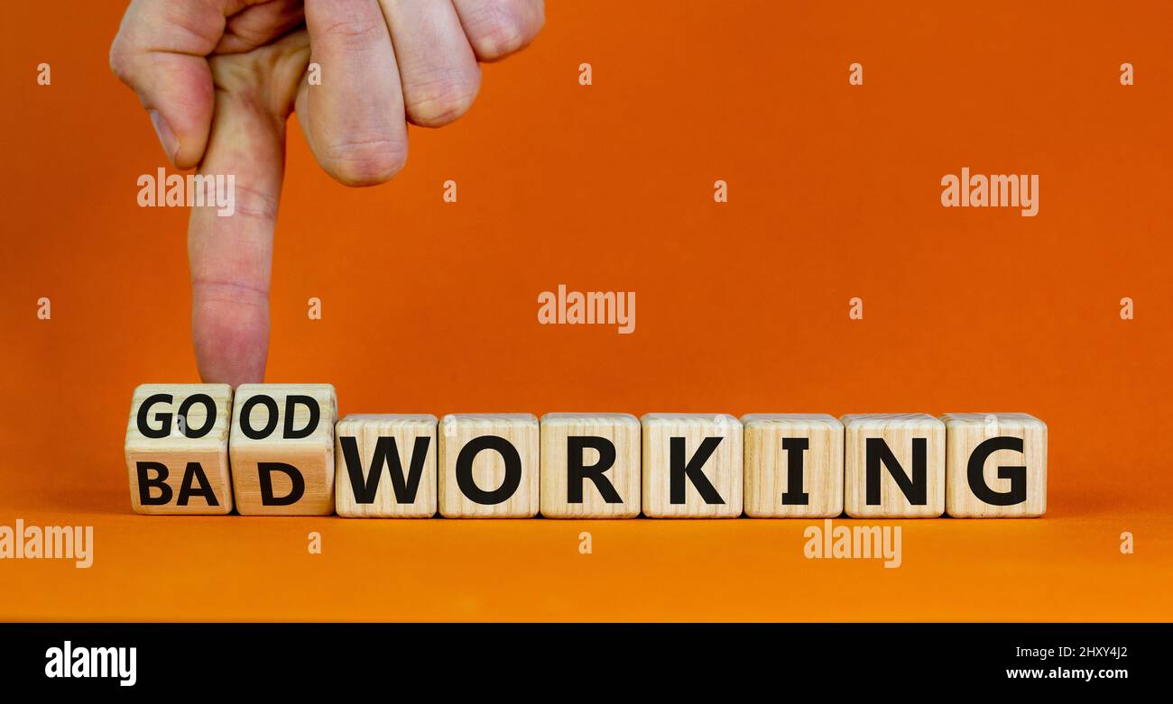 Good or bad working symbol. Businessman turns cubes and changes words