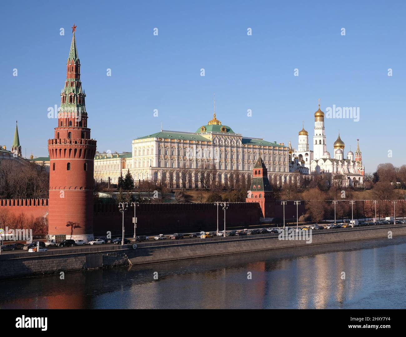 Vodovzvodnaya tower and Grand Kremlin Palace of Moscow Kremlin behind the wall on embankment ot the riverin in bright spring sunny day Stock Photo