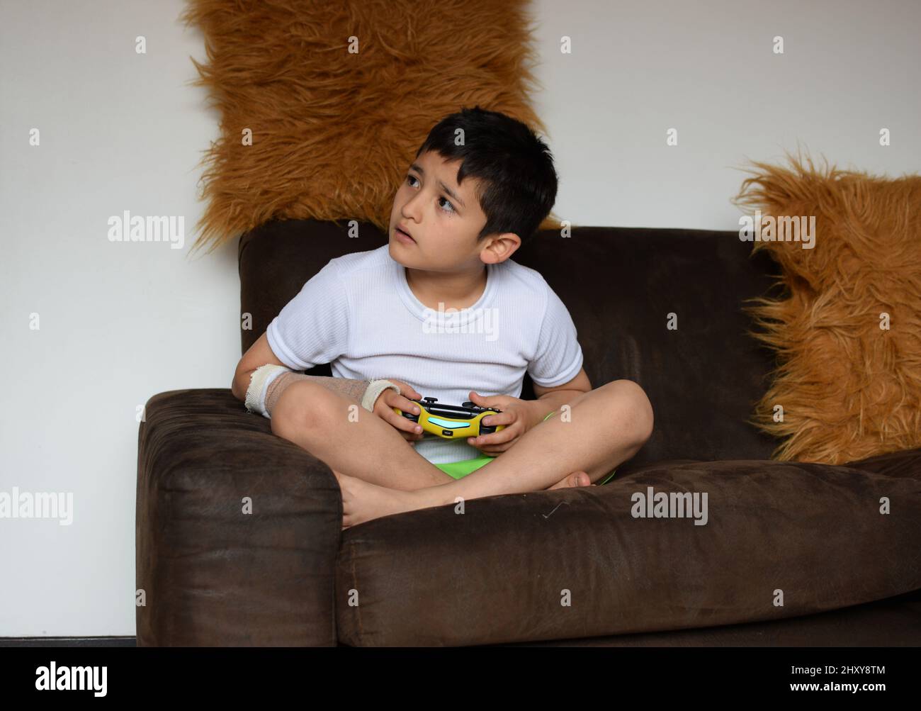 Photo of a child plaing videogames Stock Photo