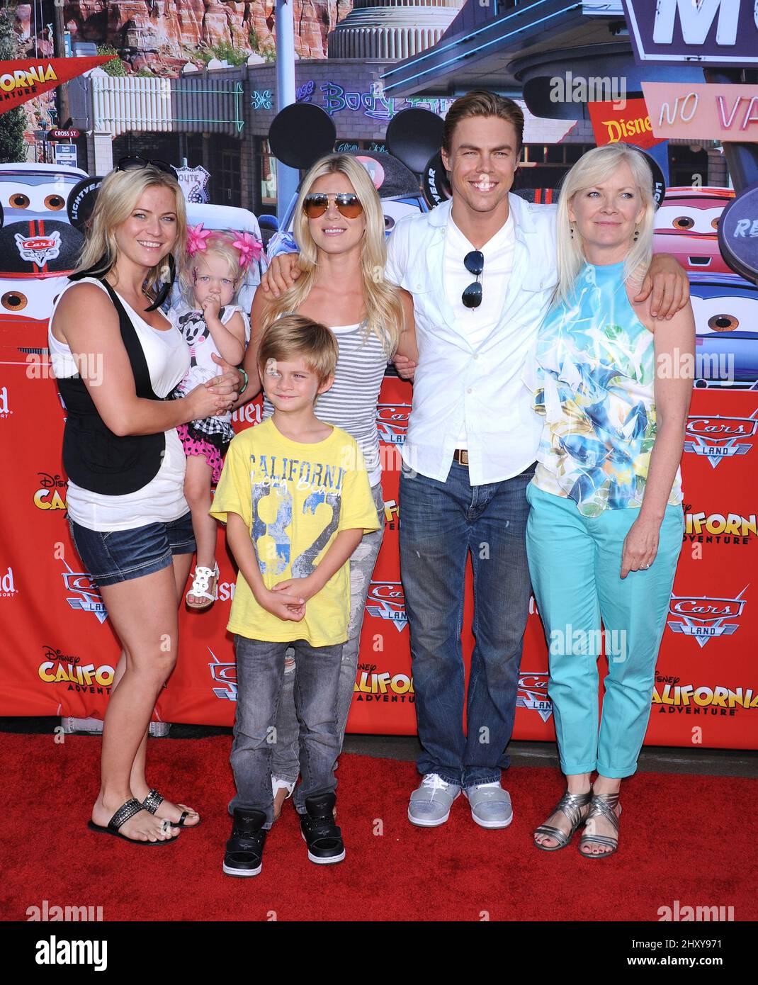 Derek Hough, sisters and mom Mari Anne attends the 'Cars Land' opening at Disney California Adventure, Anaheim. Stock Photo