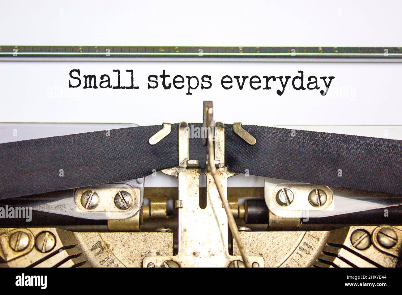 Small steps everyday symbol. Concept words Small steps everyday typed on retro typewriter. Beautiful white background. Small steps everyday business c Stock Photo