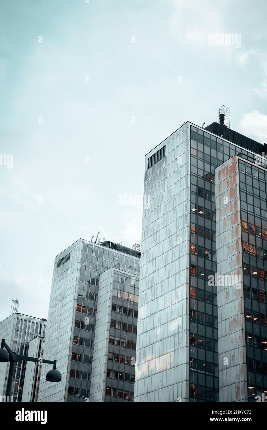 Low angle shot of modern buildings under the cloudy skies Stock Photo ...