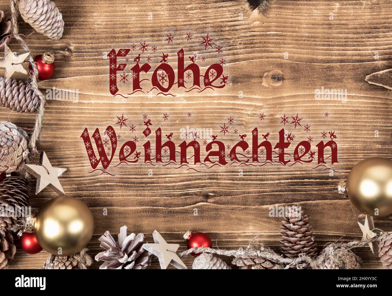 Christmas frame with red and gold balls and pine cones with text Frohe ...